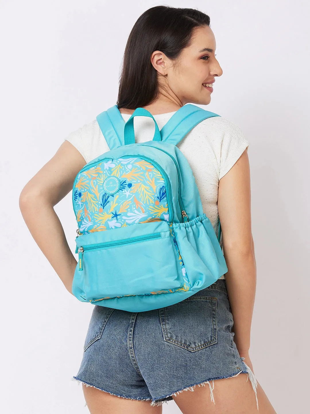 Caprese Xenia Backpack Medium Dual Compartment Turquoise Printed